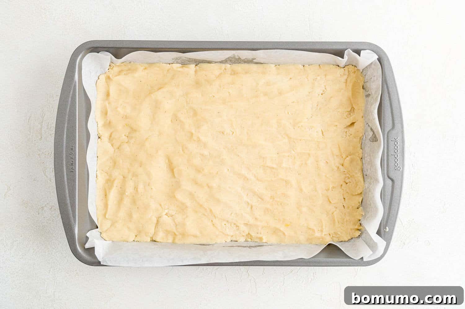 Baked cookie bars without frosting, freshly removed from the oven and cooling on a rack.