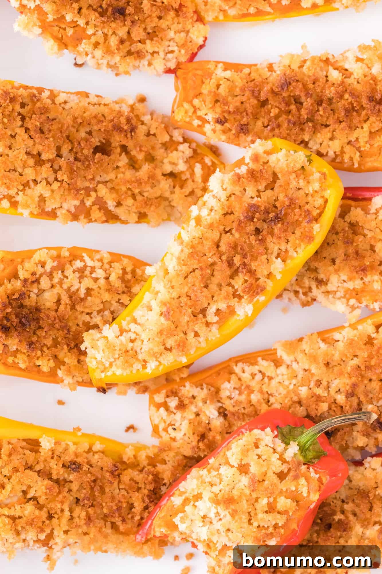 Vibrant Southwestern Stuffed Mini Sweet Peppers with a golden-brown panko topping, arranged beautifully on a serving platter.