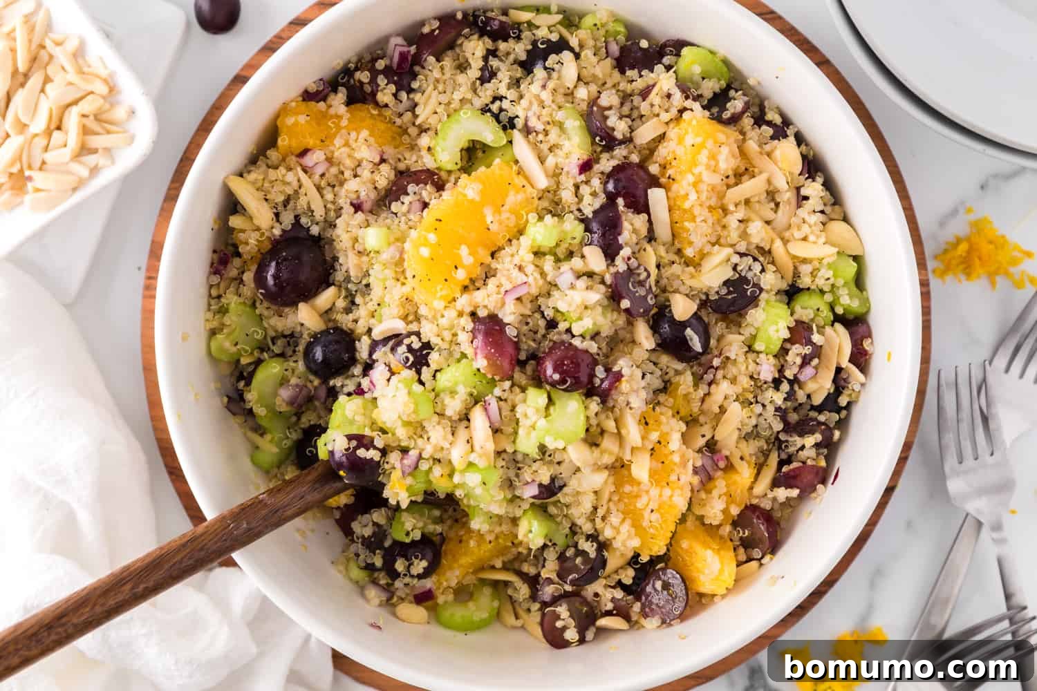 The vibrant ingredients of the quinoa salad, now lightly combined in a large bowl, ready for the dressing.