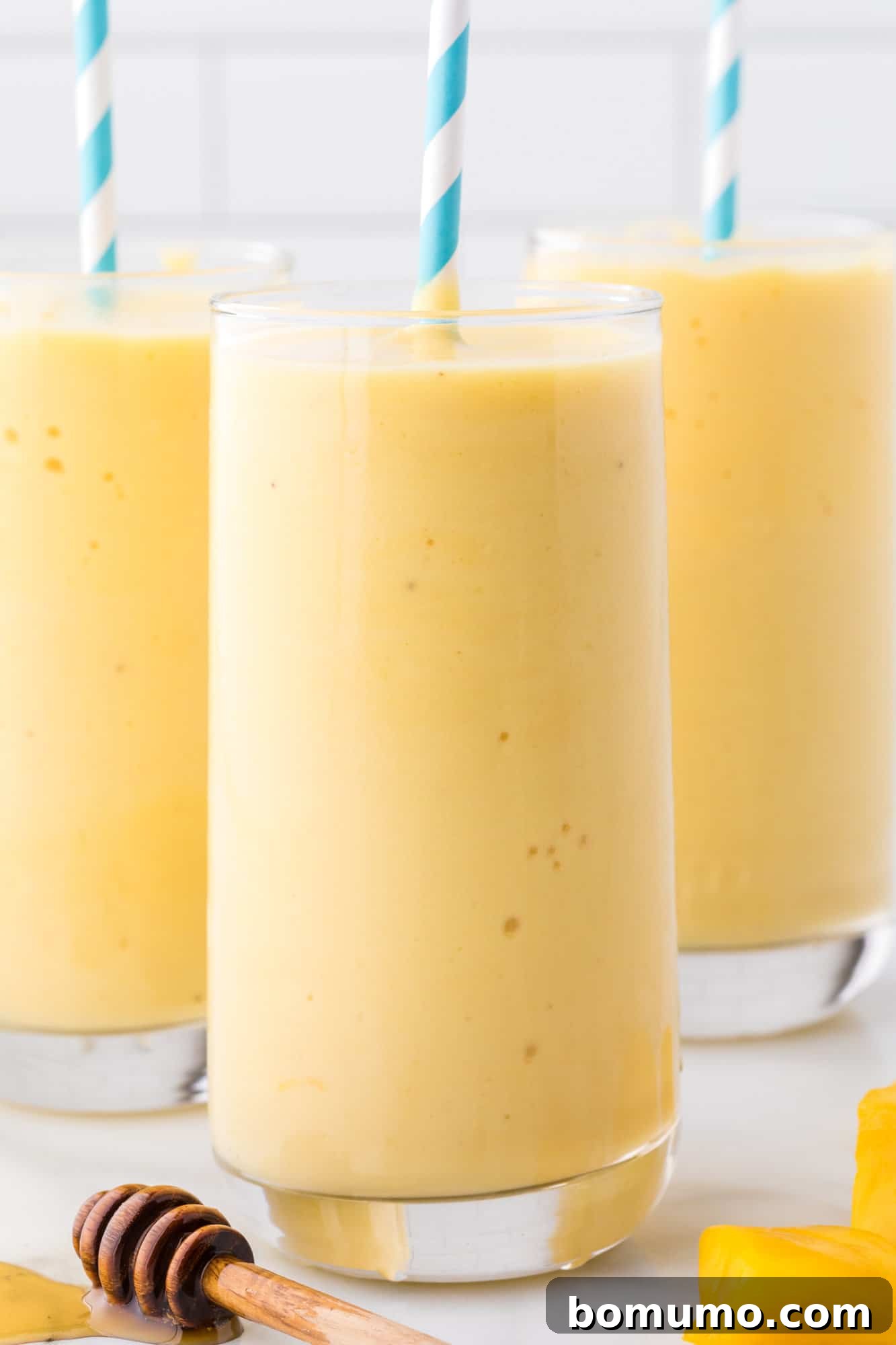 Smoothies with blue straws.