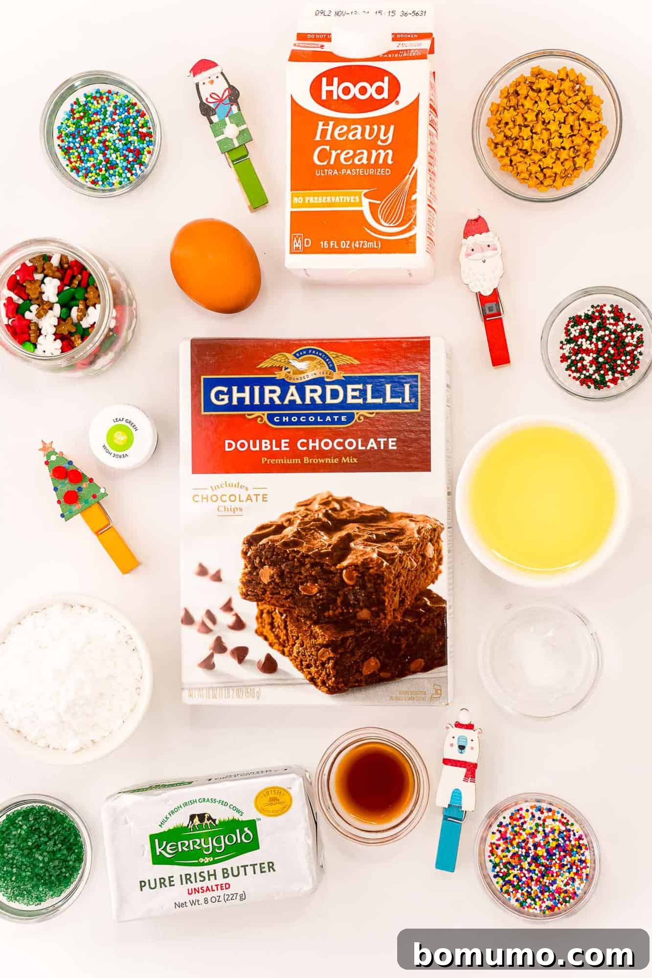 Overhead view of all the necessary ingredients for baking Christmas Tree Brownie Bites, neatly arranged on a kitchen counter.