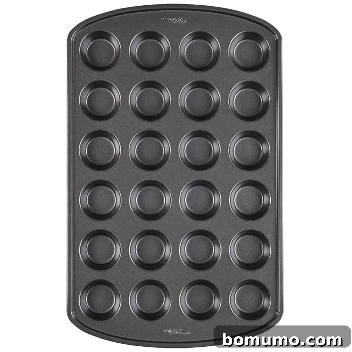 Close-up of a nonstick mini muffin pan on a white background, highlighting its individual cups.