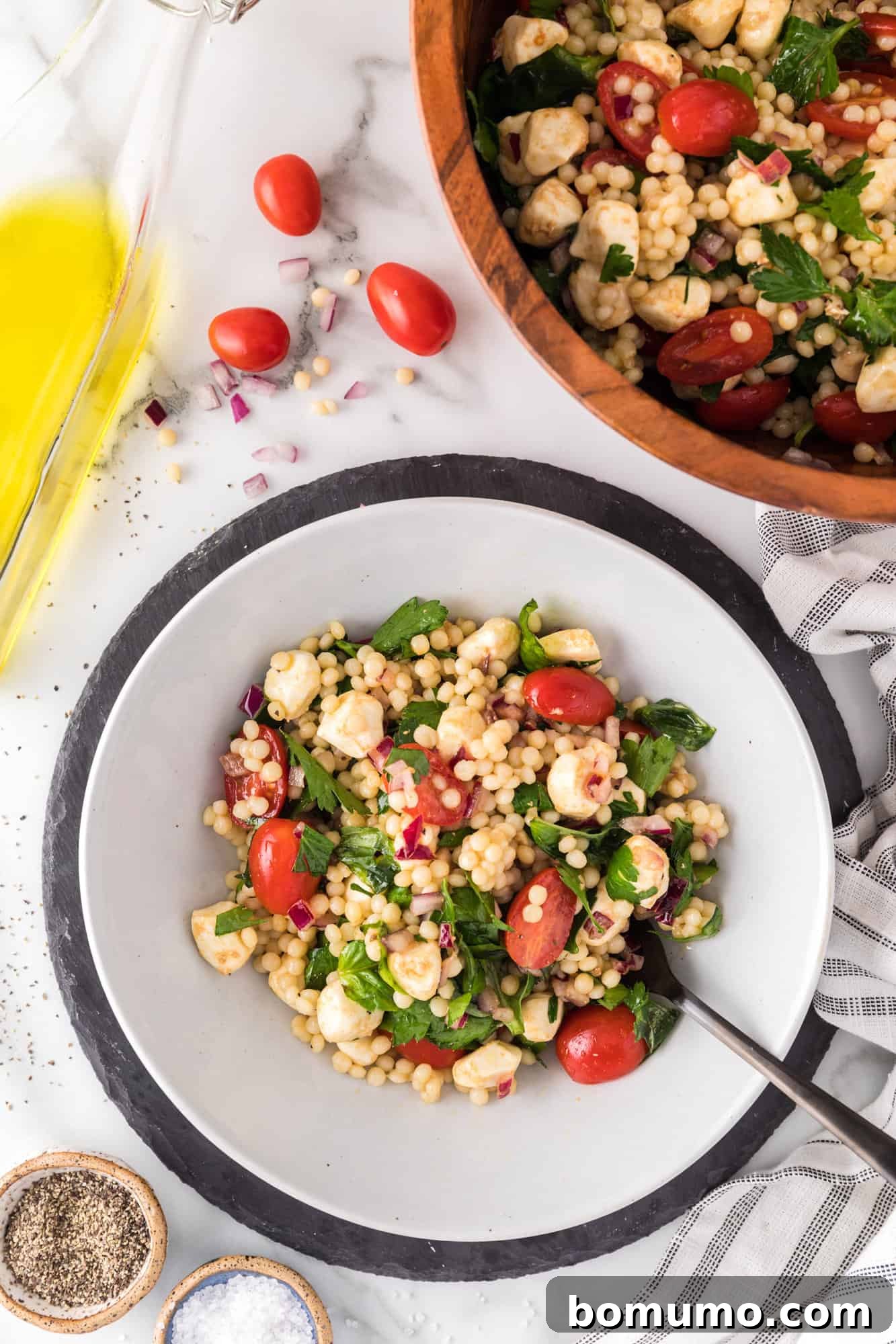 Couscous salad dished up into a smaller bowl.