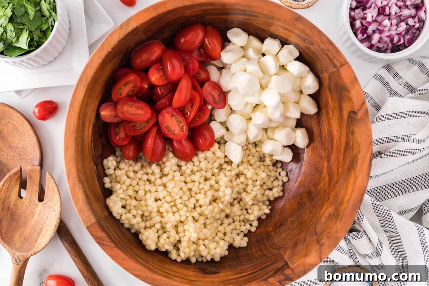 Tomatoes added to bowl.