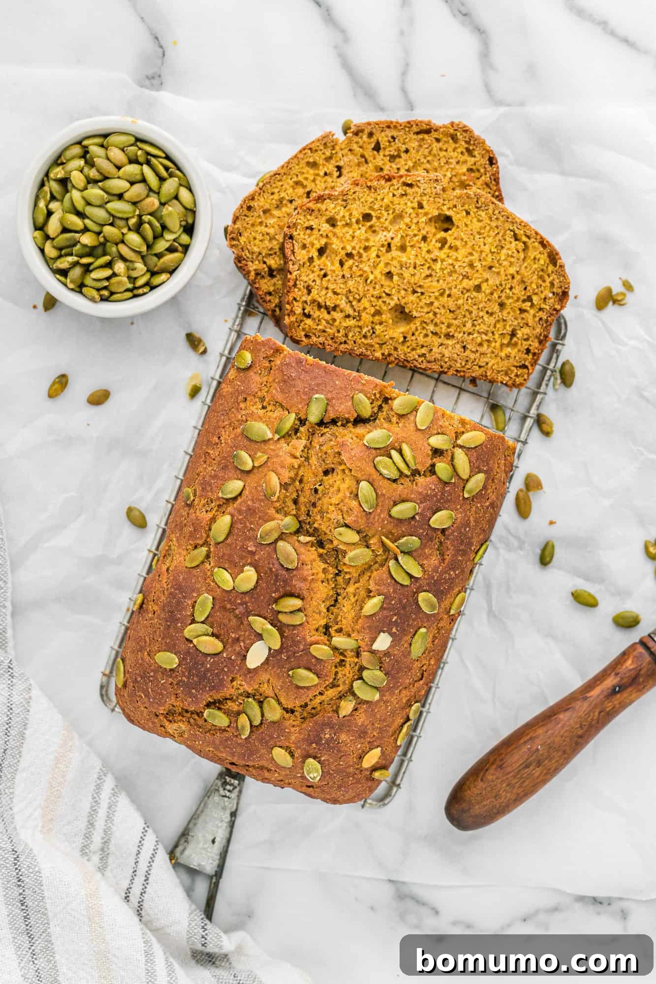 An inviting overhead view of a perfectly sliced healthy pumpkin bread, ready to be enjoyed.