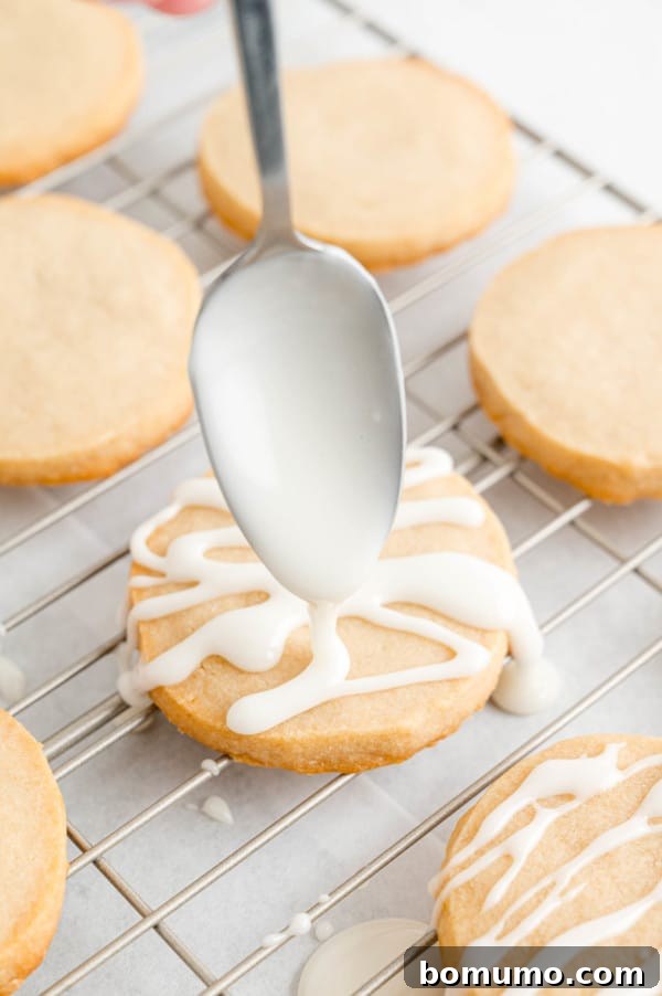 Glaze being added to cookies.