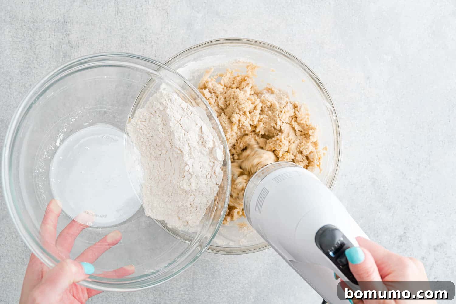 Flour being added to dough.