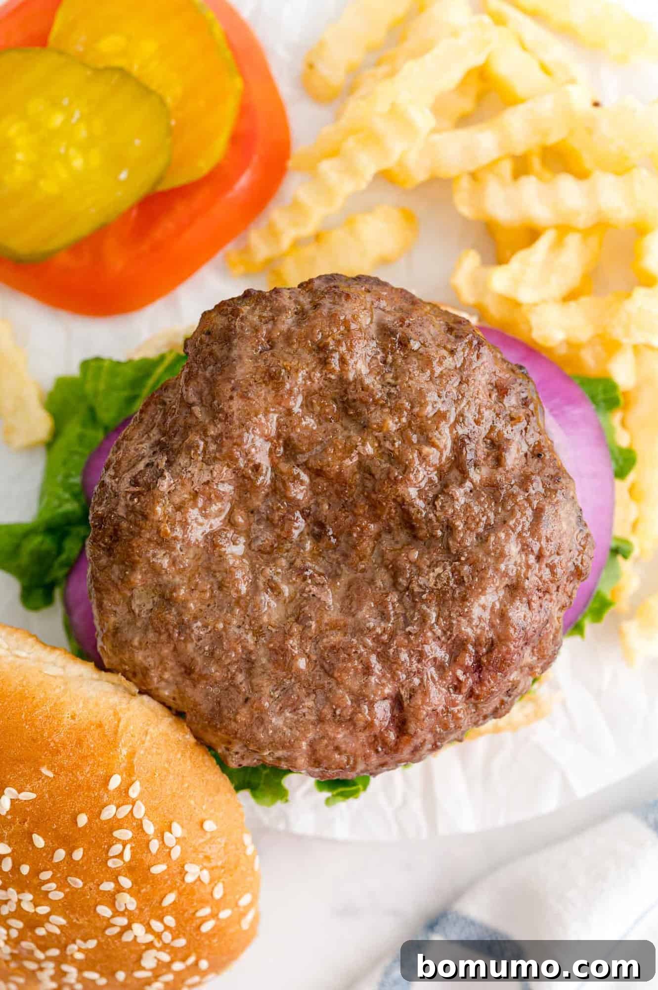 Overhead view of open faced burger.