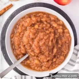 Crockpot applesauce in a large white bowl.