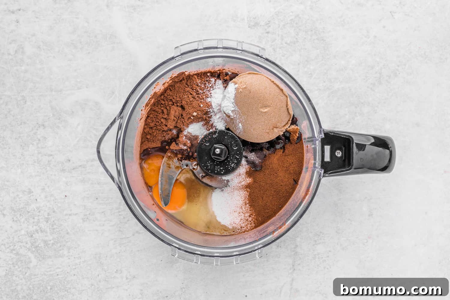 All black bean brownie ingredients, except chocolate chips, in a blender before blending.