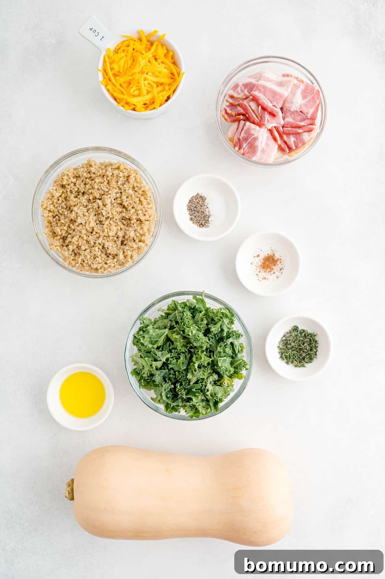 Overhead view of ingredients needed including a whole squash.