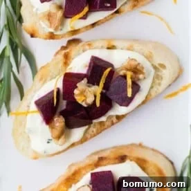 An overhead photograph of vibrant beets and tangy goat cheese elegantly arranged on crispy crostini.