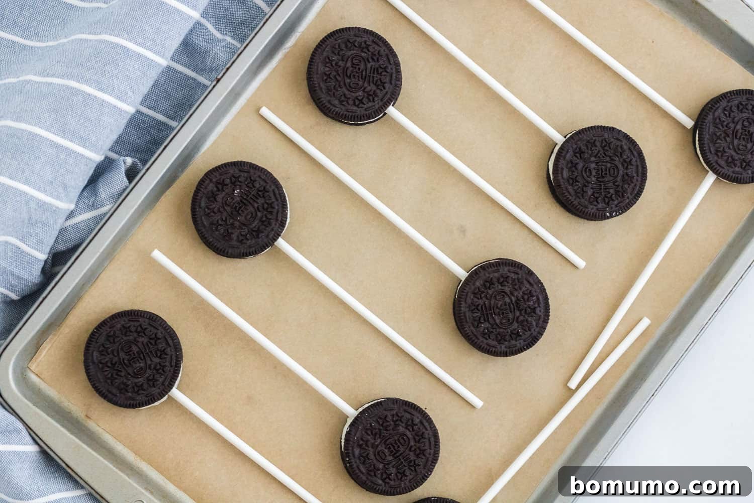 Oreos with sticks inserted in them.