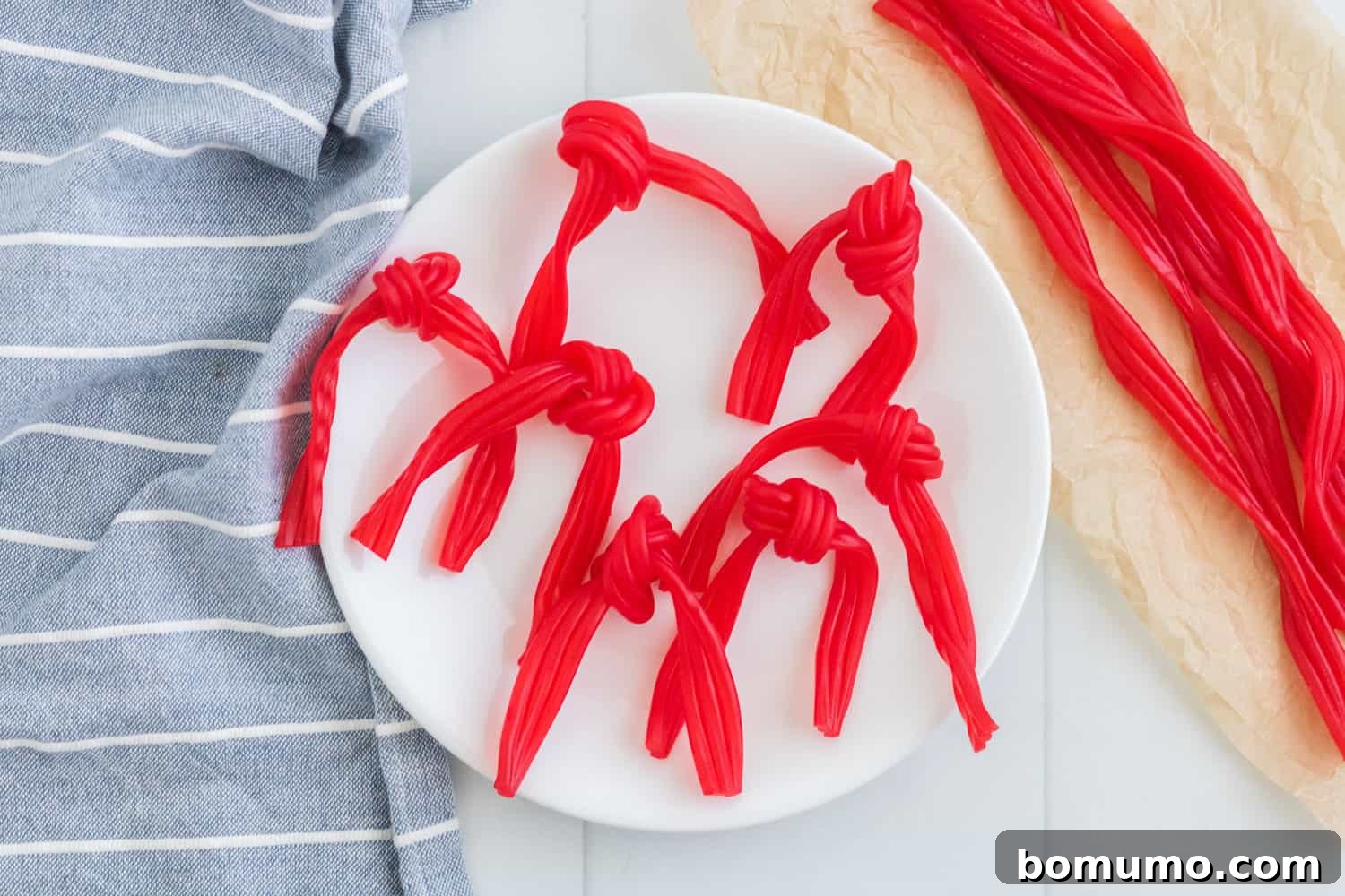 Licorice scarves on a white plate.