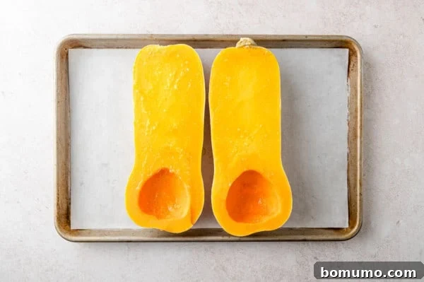 Cut squash on baking sheet.