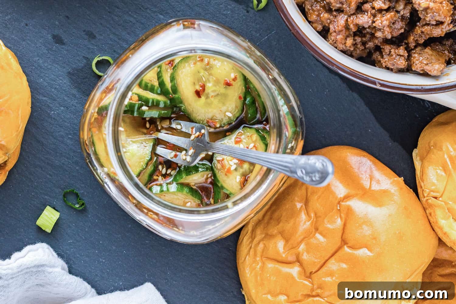 Pickles in a small glass jar.
