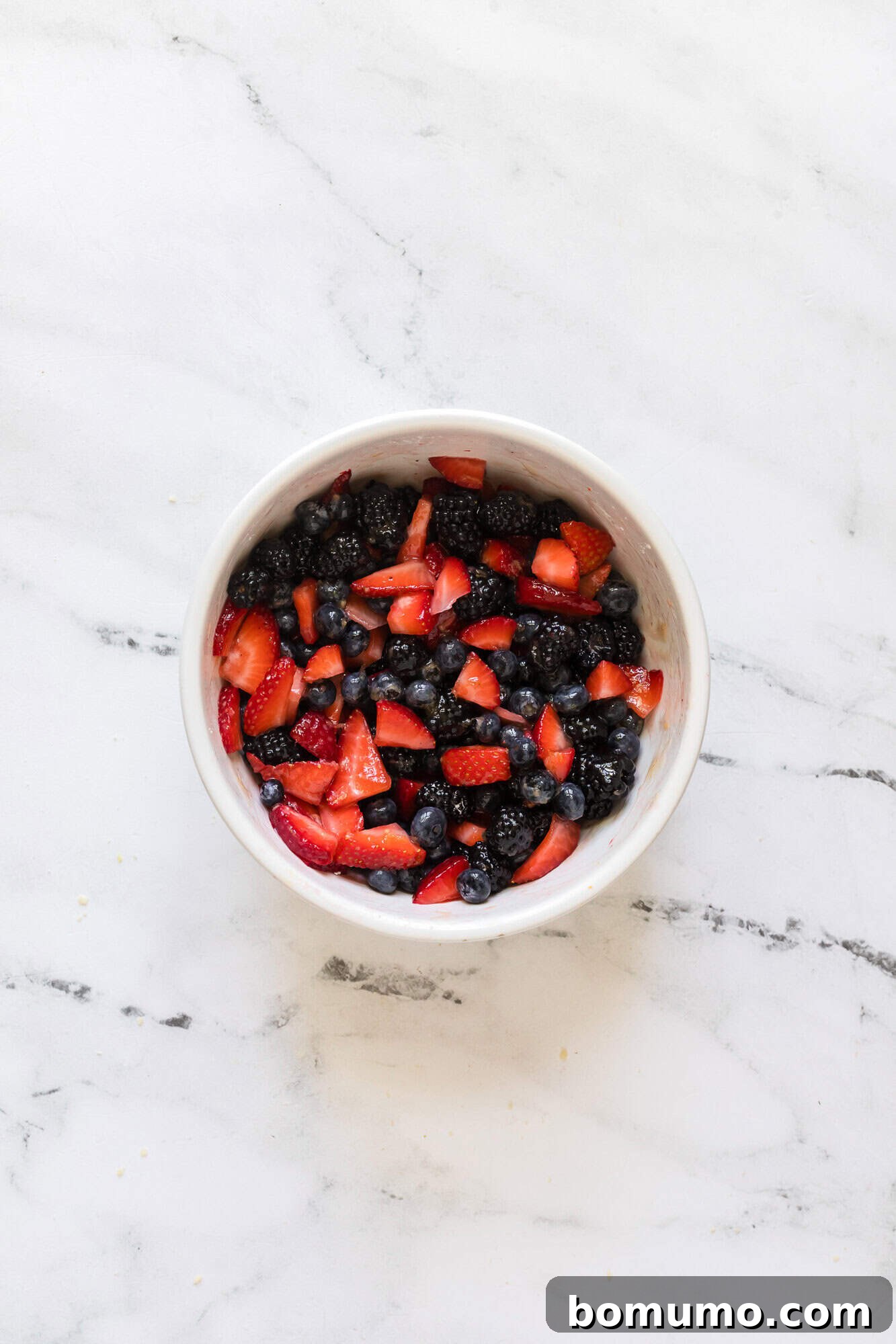 The berry filling ingredients after being gently mixed together, ready to macerate.