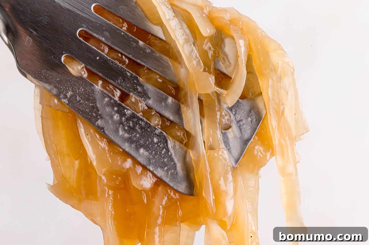 Caramelizing Onions: A Comprehensive Guide 12 Onions in tongs