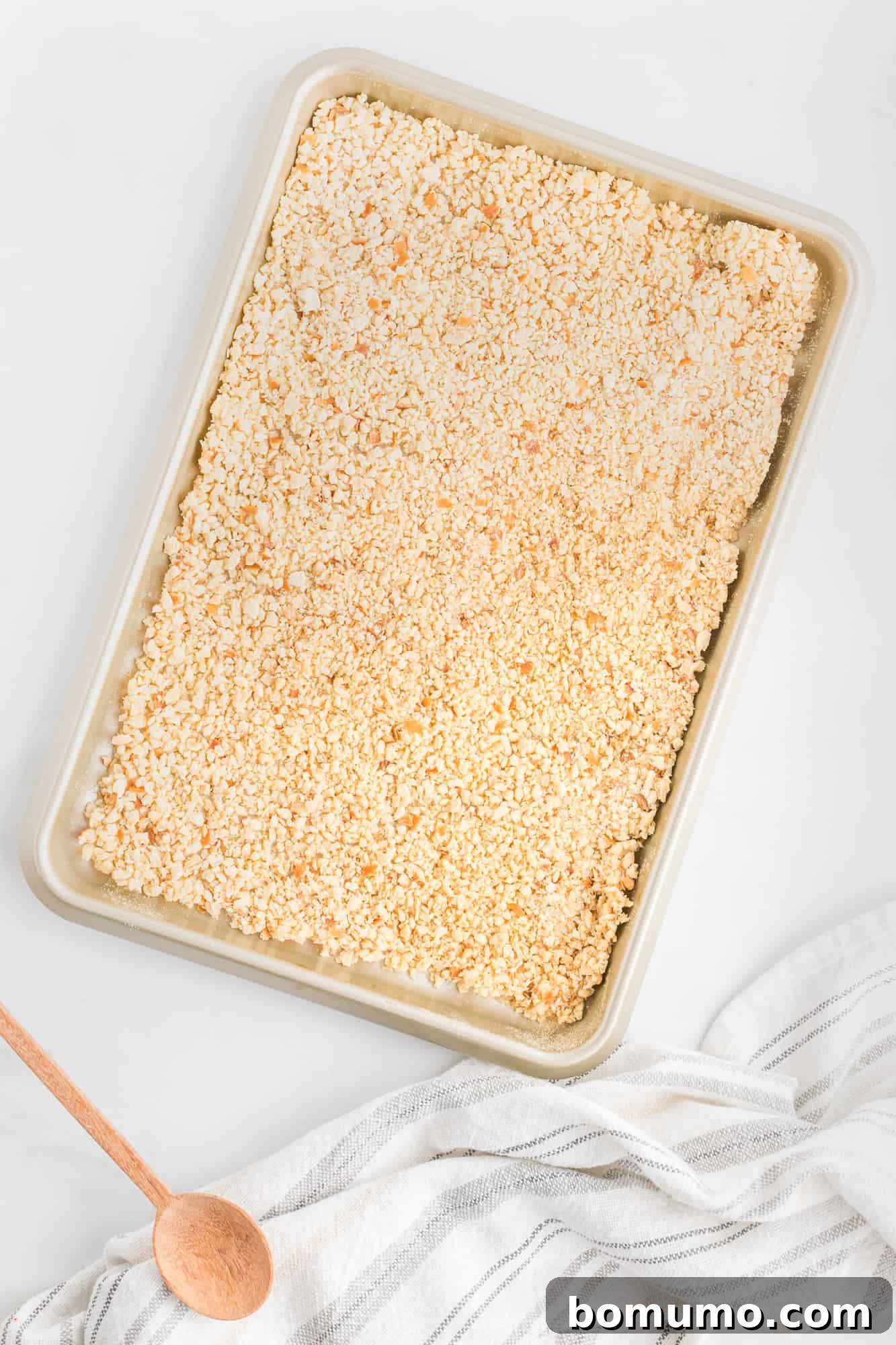 Bread crumbs on a baking sheet.
