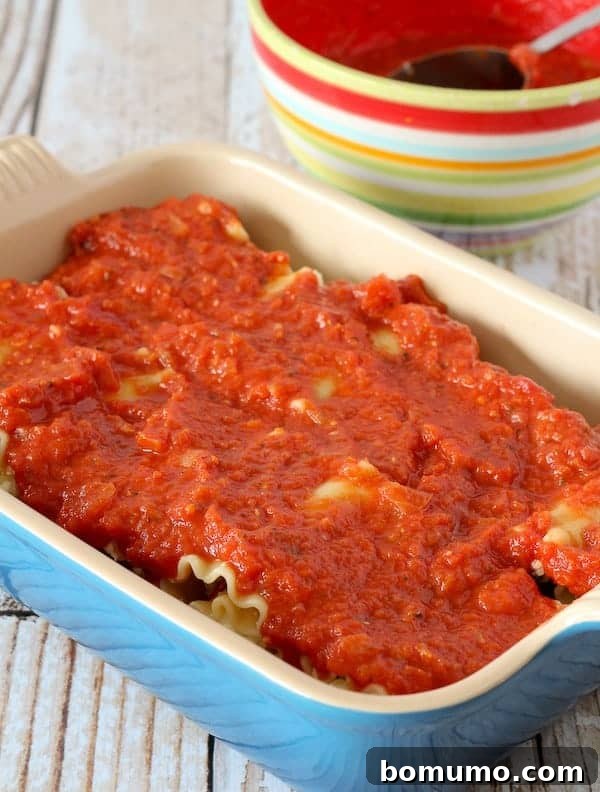 Sauce added to the top of the lasagna rolls.