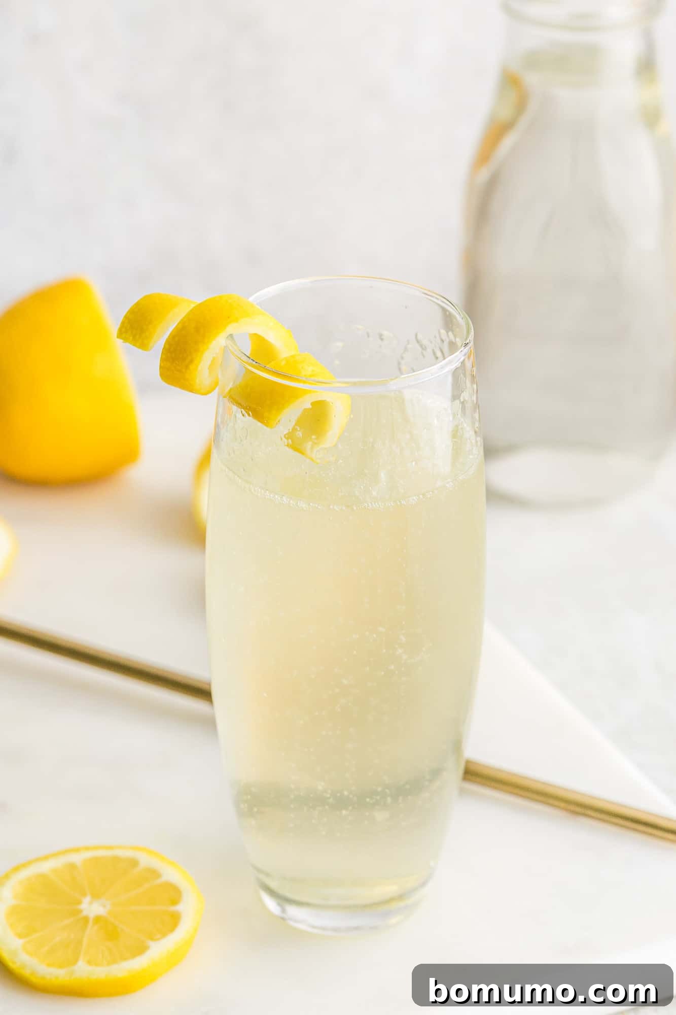 Lemon twist garnishing a cocktail.