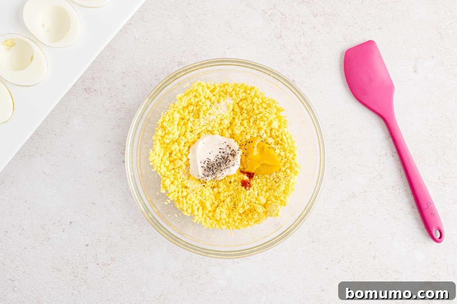 Mashed egg yolks with mayonnaise, mustard, salt, pepper, tabasco.