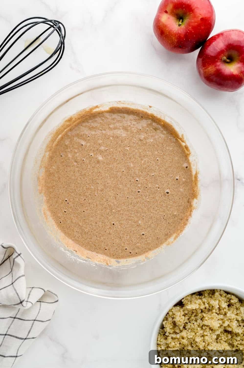Dry ingredients smoothly integrated into the pancake batter, creating a uniform texture.