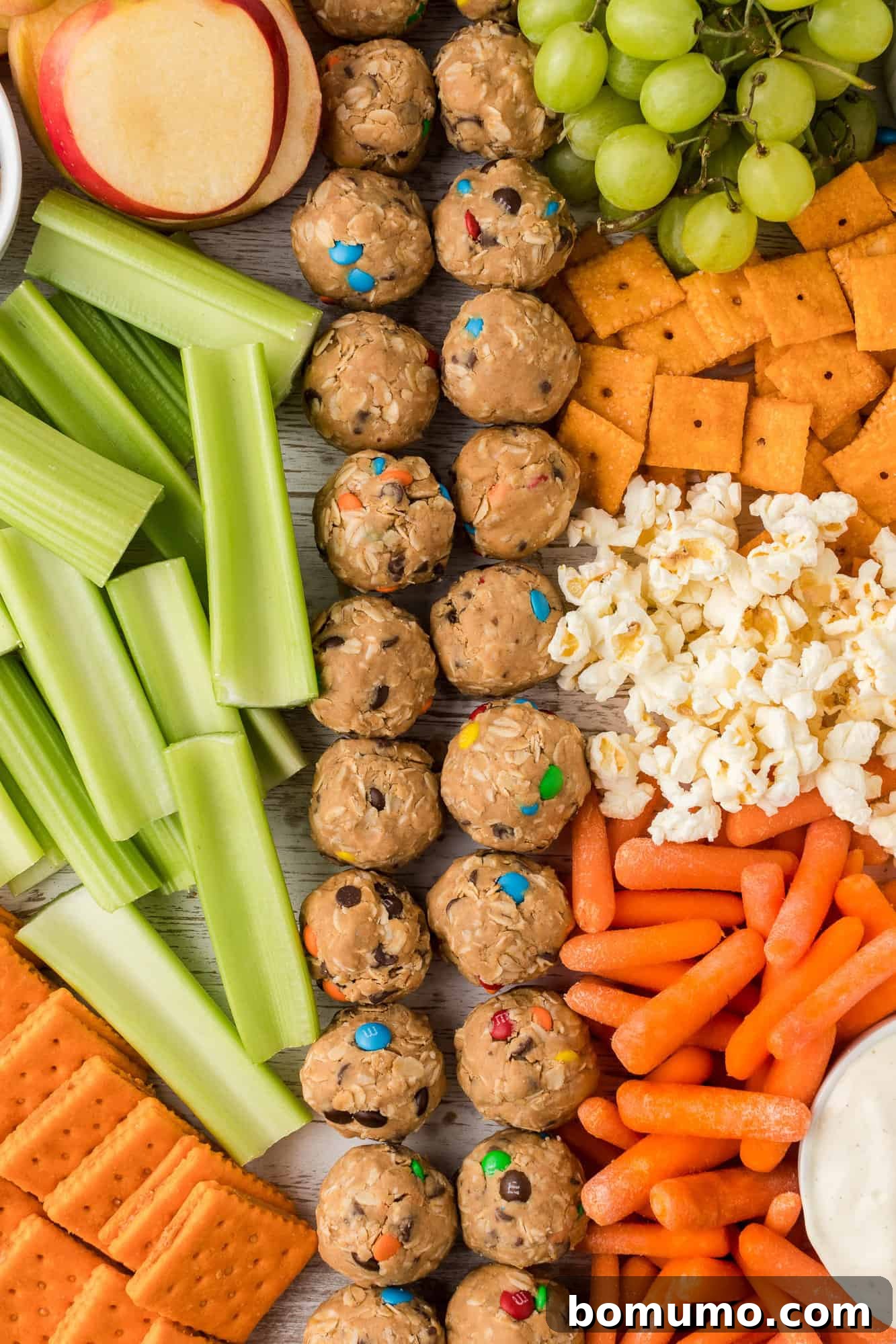 A close-up view of various delicious items meticulously arranged on a snack board.