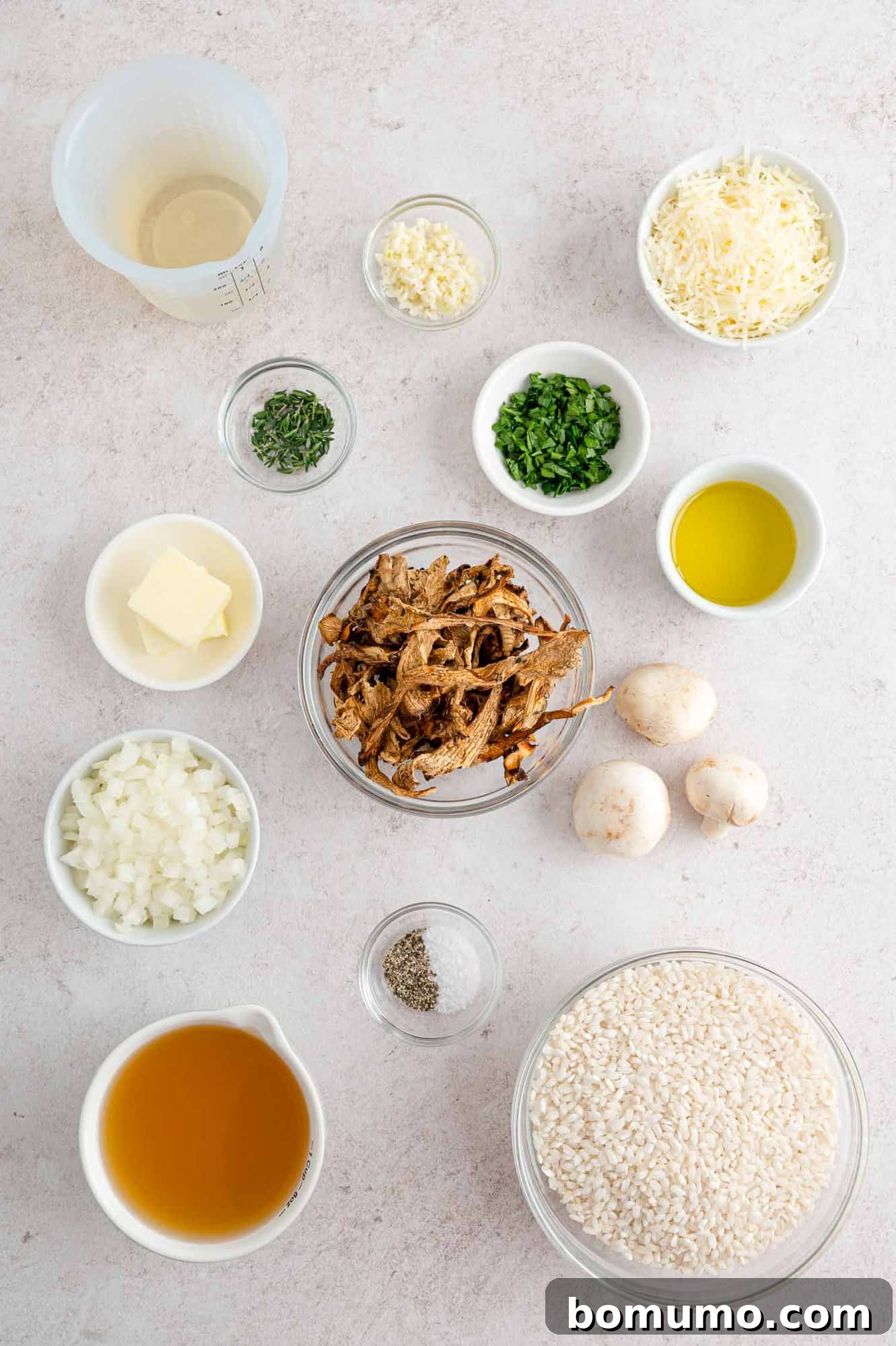 Fresh Ingredients for Homemade Mushroom Risotto A selection of fresh ingredients for mushroom risotto, including mushrooms, rice, garlic, onion, and herbs.