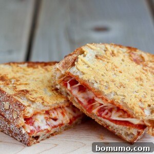 Pepperoni Pizza Grilled Cheese with a crispy parmesan cheese crust - so good you'll never go back to plain grilled cheese! Find the recipe on RachelCooks.com