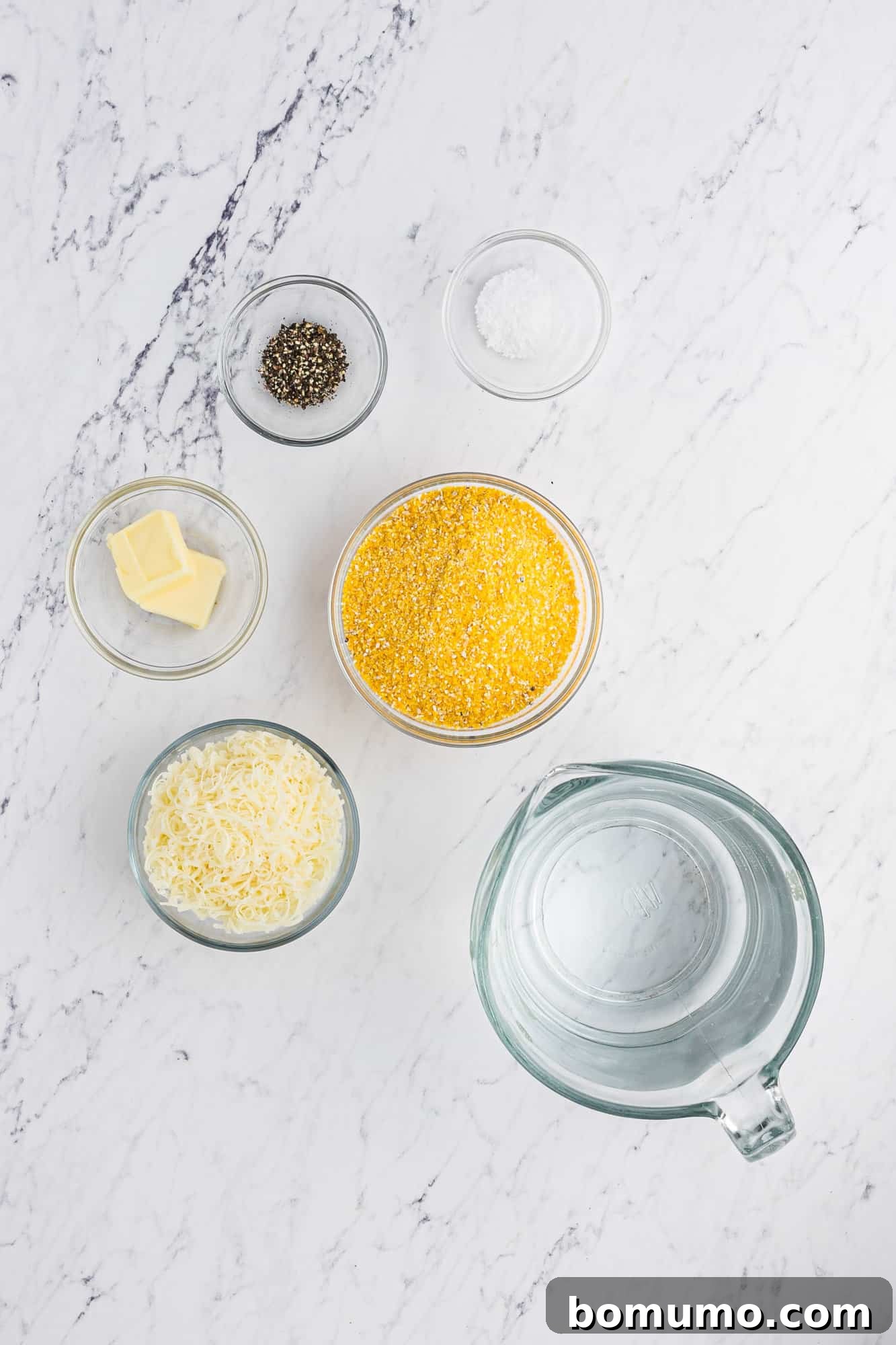 Ingredients needed for Instant Pot polenta, including uncooked coarse ground cornmeal, butter, and salt.