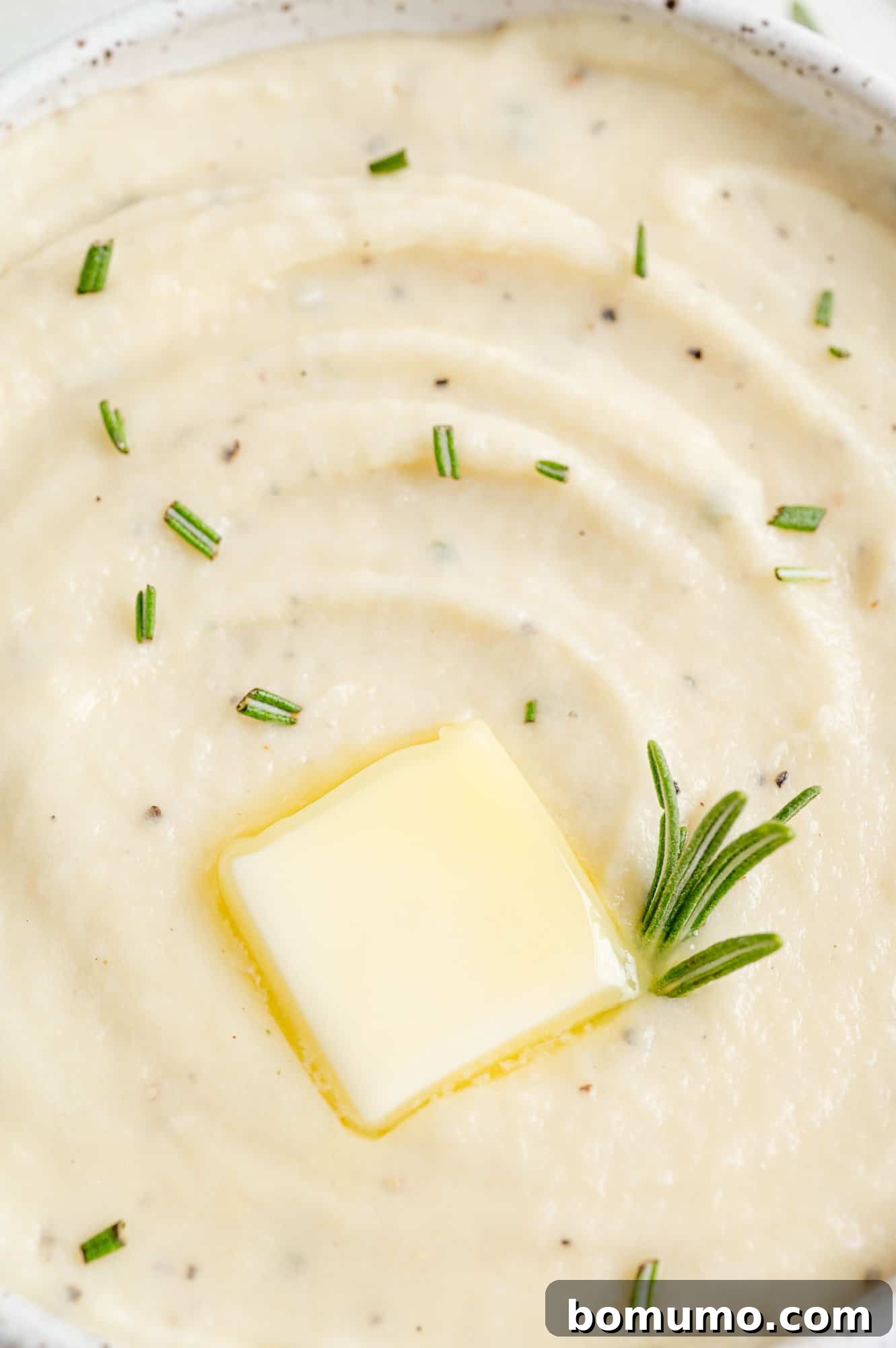 Silken Parsnip Puree 12 Close up view of melted butter on top of creamy parsnip puree.