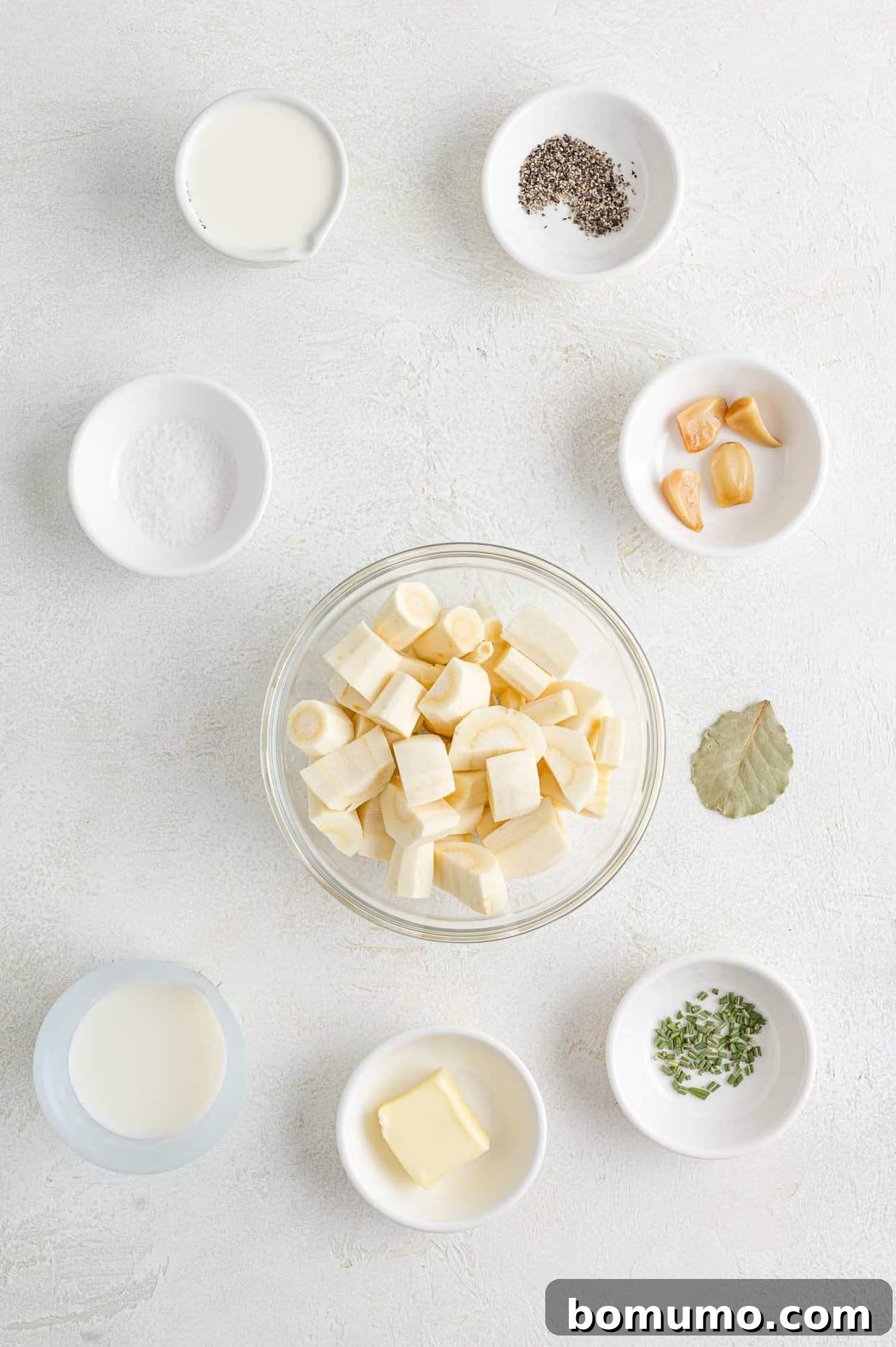 Silken Parsnip Puree 4 Ingredients needed for parsnip puree recipe including parsnips, cream, butter, and rosemary.