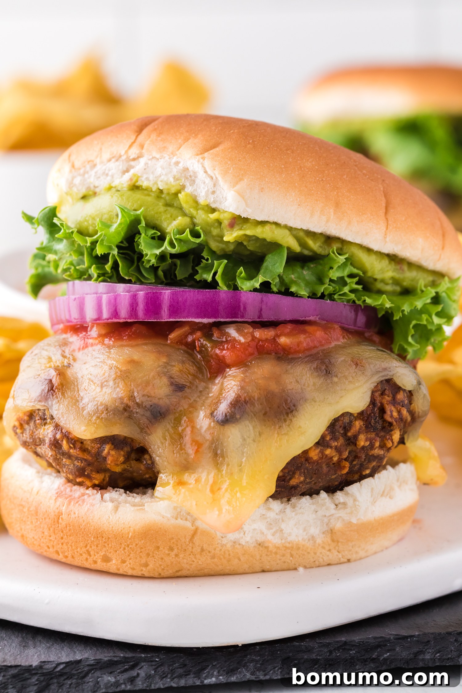 Taco turkey burger with variety of toppings.