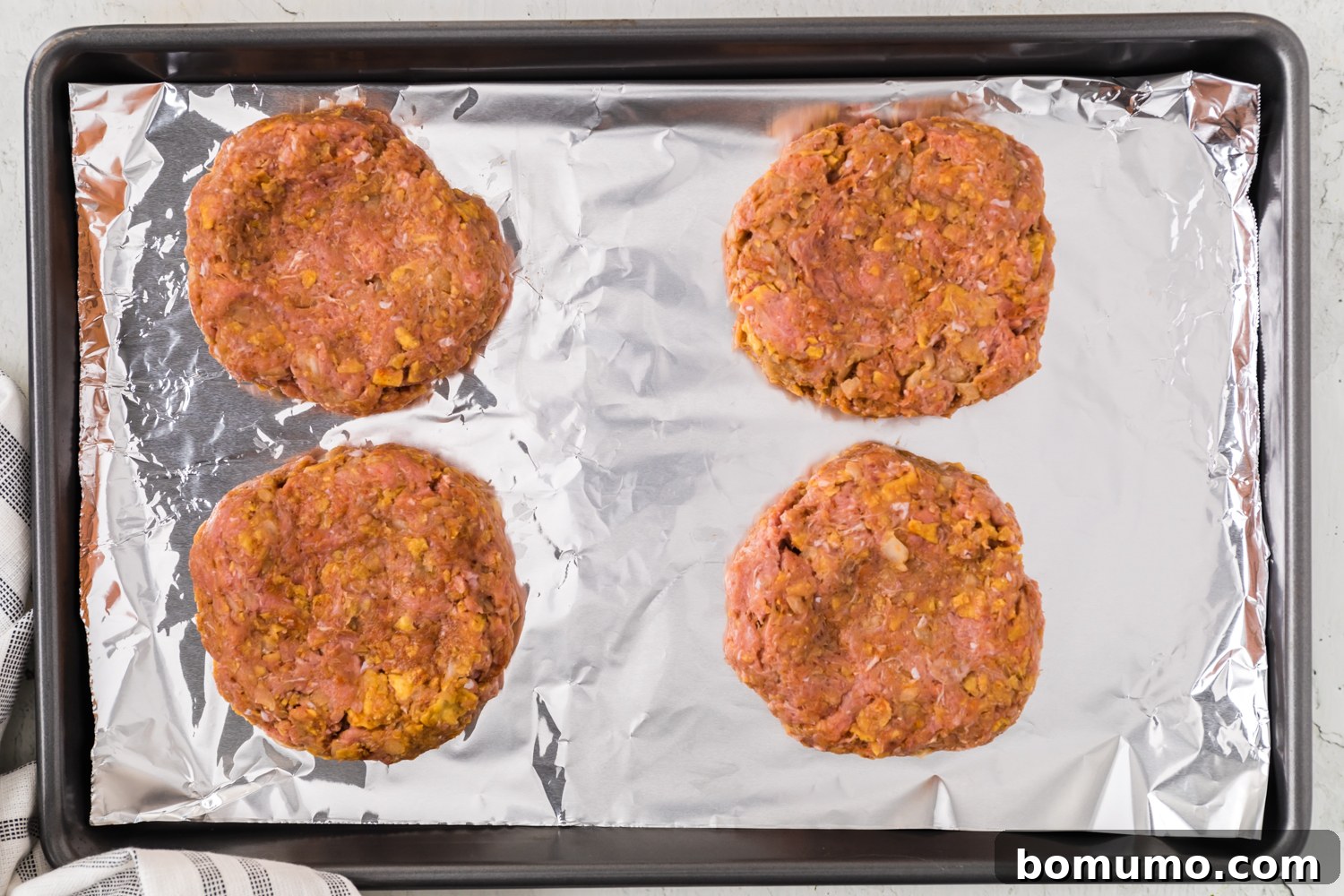 Uncooked burger patties.