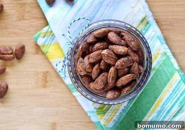 Zero Sugar Cinnamon Roasted Almonds 3 Overhead view of almonds in a jar, showcasing a healthy, sugar-free snack option.