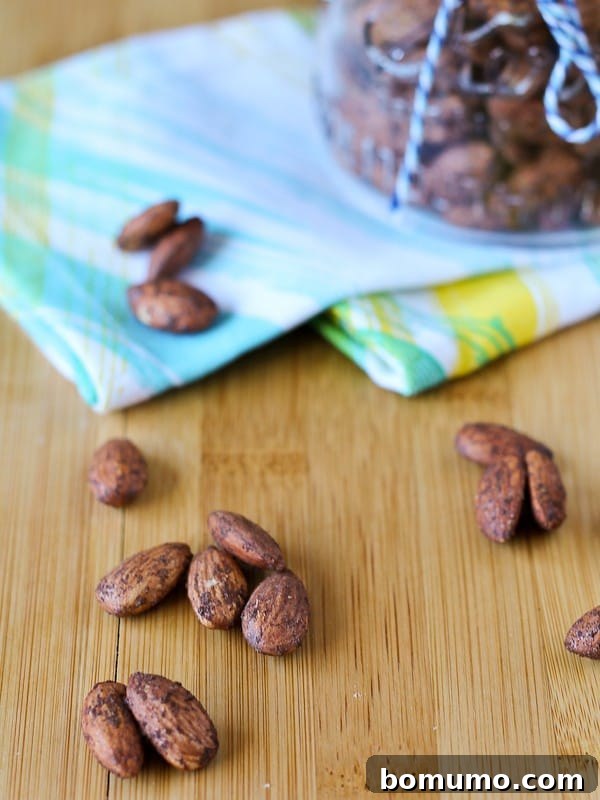 Zero Sugar Cinnamon Roasted Almonds 4 Almonds on a wooden surface, ready to be enjoyed as a sugar-free snack.
