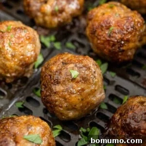 Air fryer meatballs still in air fryer.