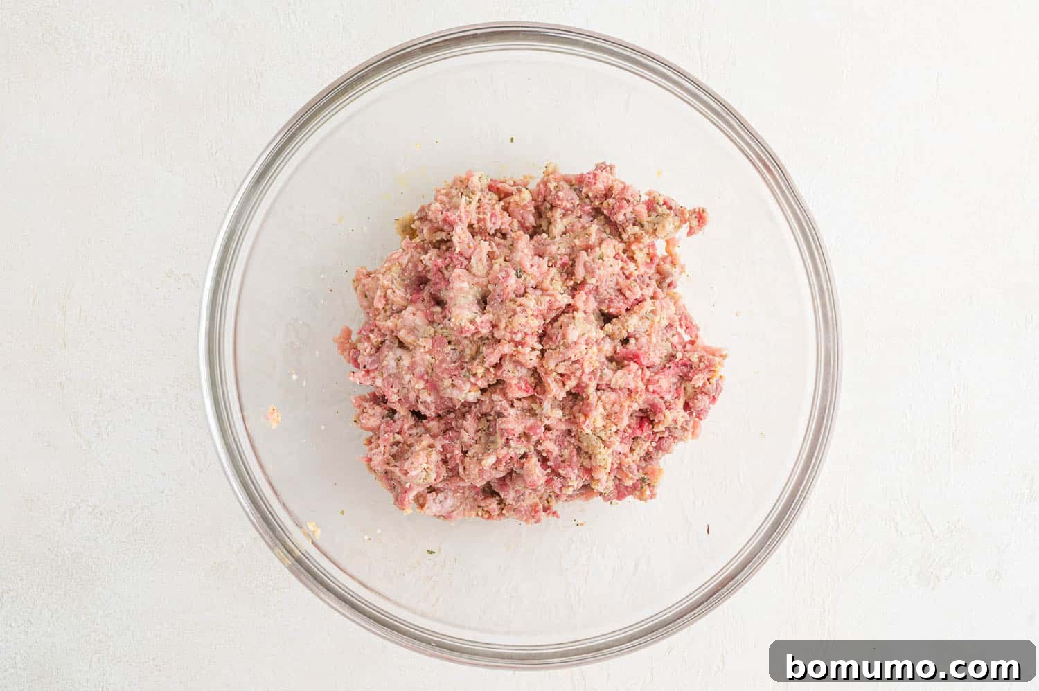 The meatball mixture, with all ingredients thoroughly combined, ready for shaping.