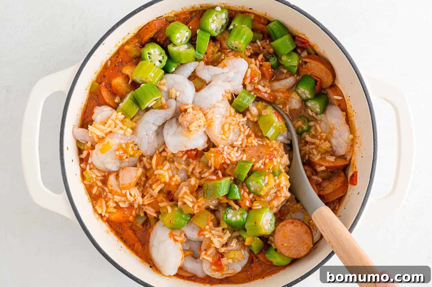 Shrimp and okra added to pan.