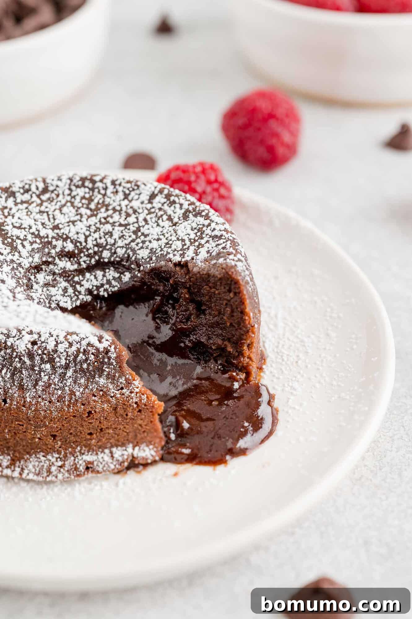 Chocolate lava cake with chocolate inside oozing out.