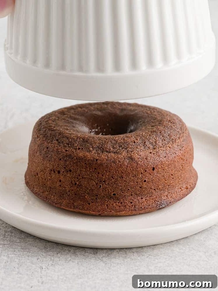 Lava cake coming out of ramekin.