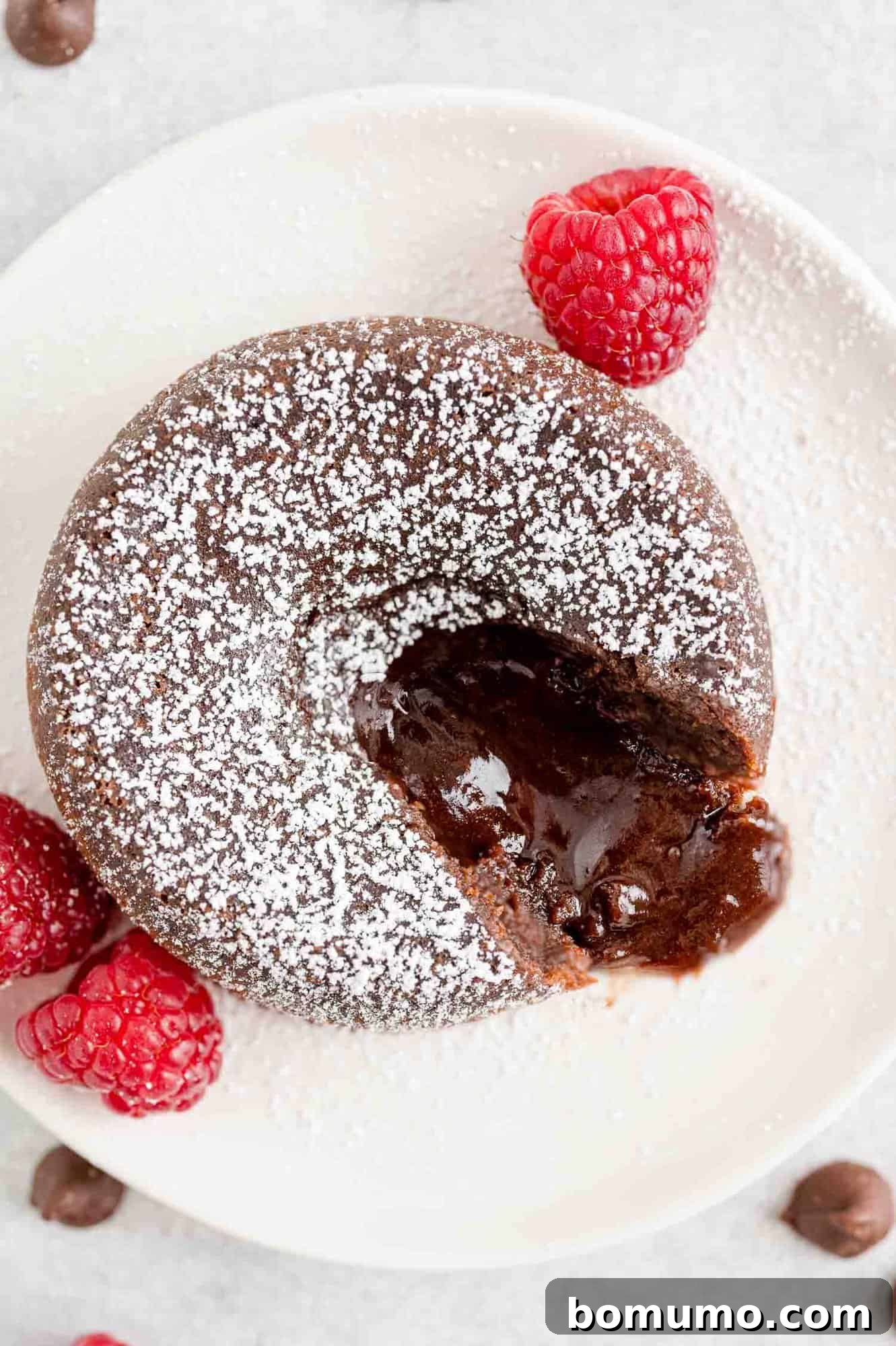 Chocolate filling oozing out of powdered sugar dusted cake.
