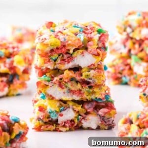 Stack of three fruity pebbles treats.