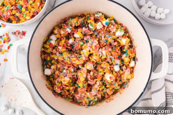 Fruity Pebbles treats mixture in a saucepan.