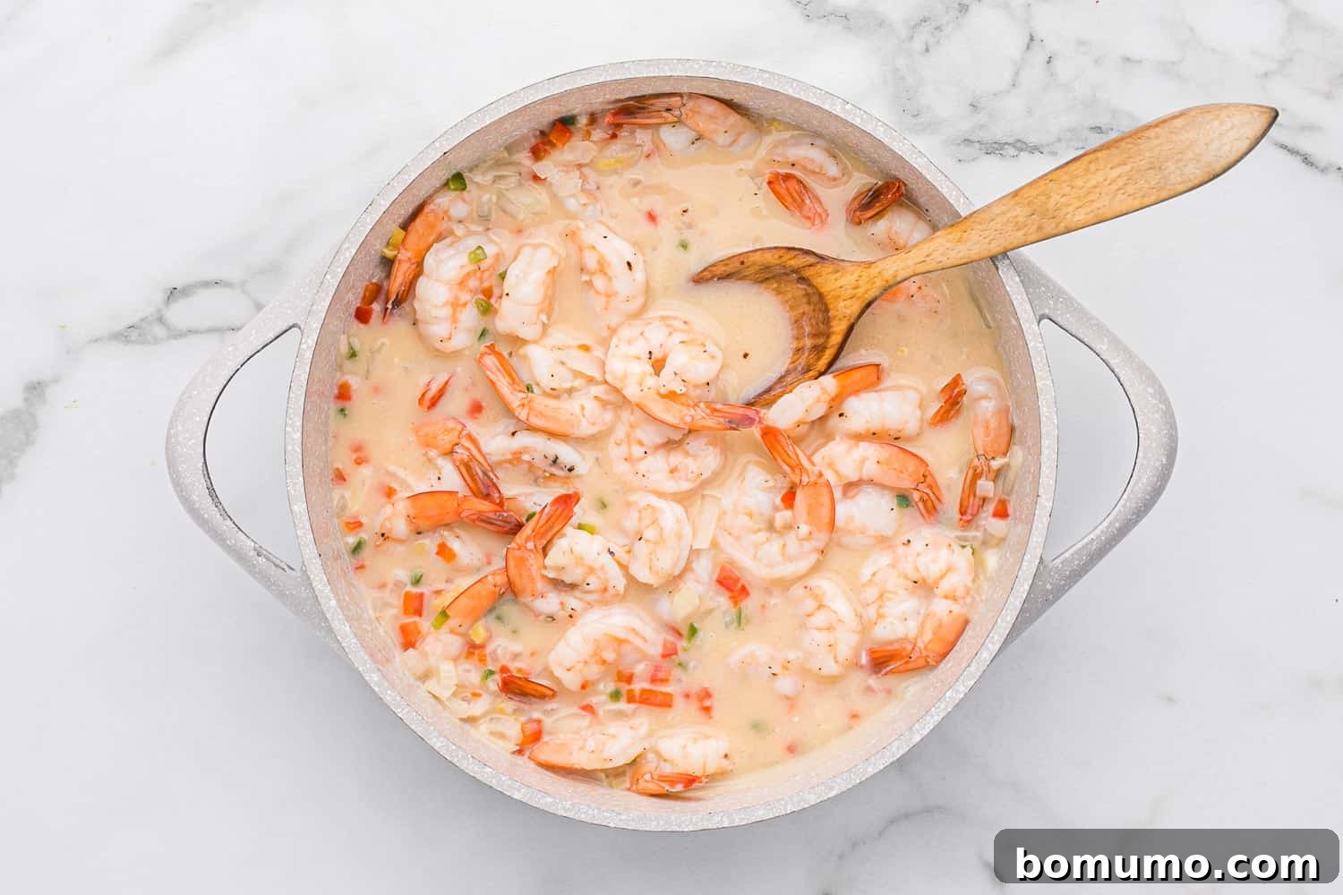 Succulent shrimp returned to the pan, mingling with the creamy coconut sauce.