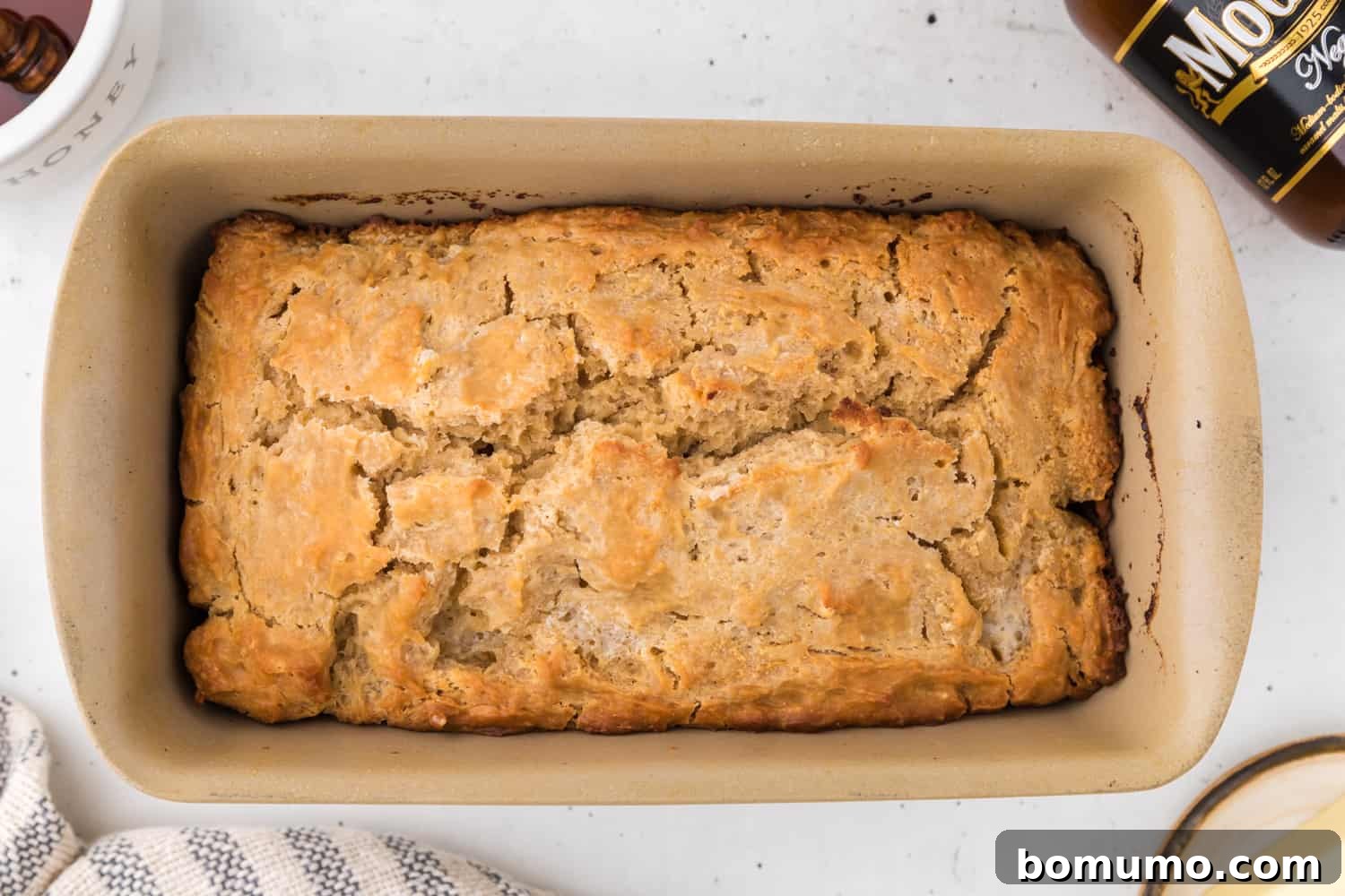 Baked bread in a loaf pan.
