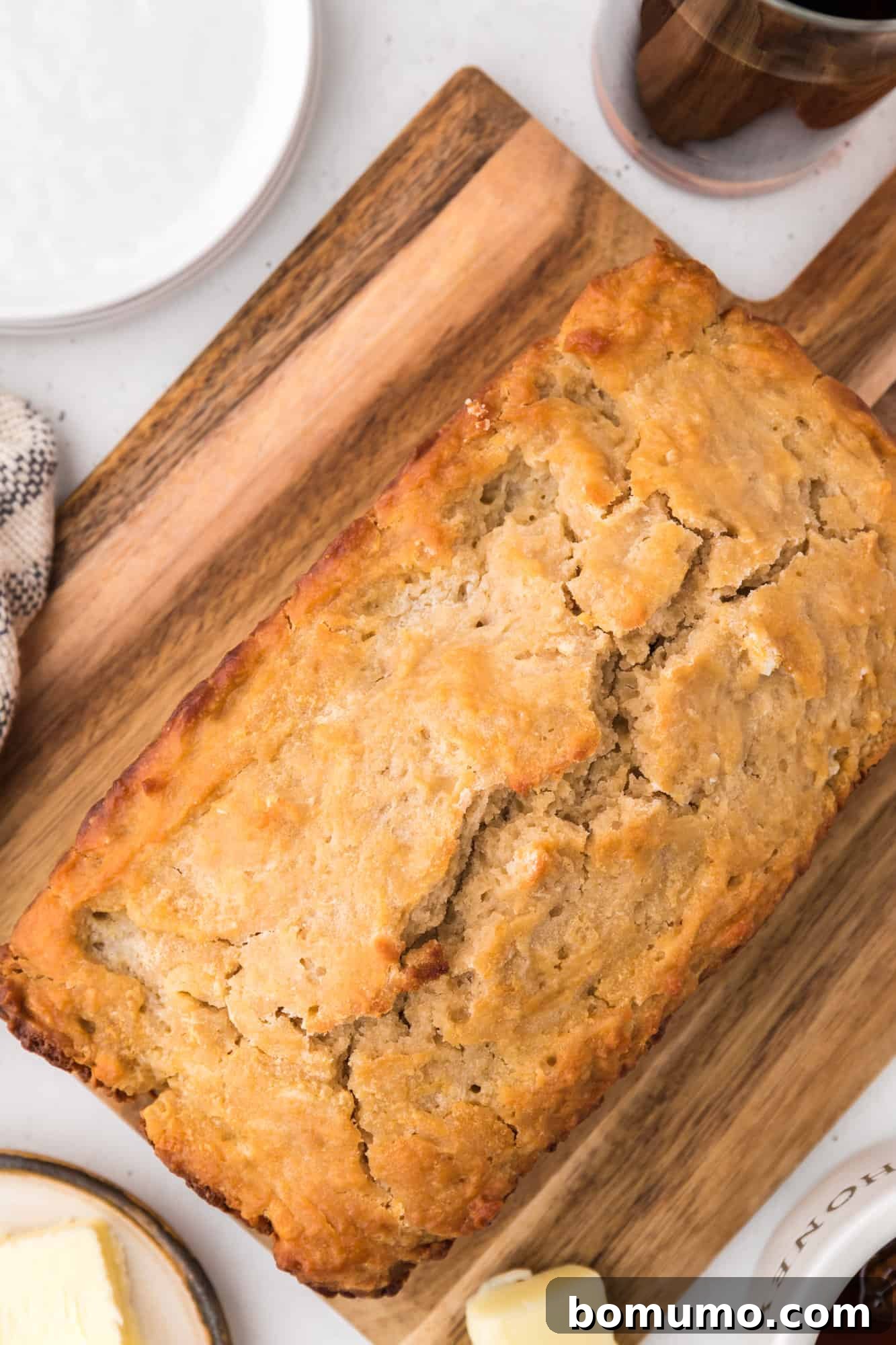 Bread on cutting board, unsliced.