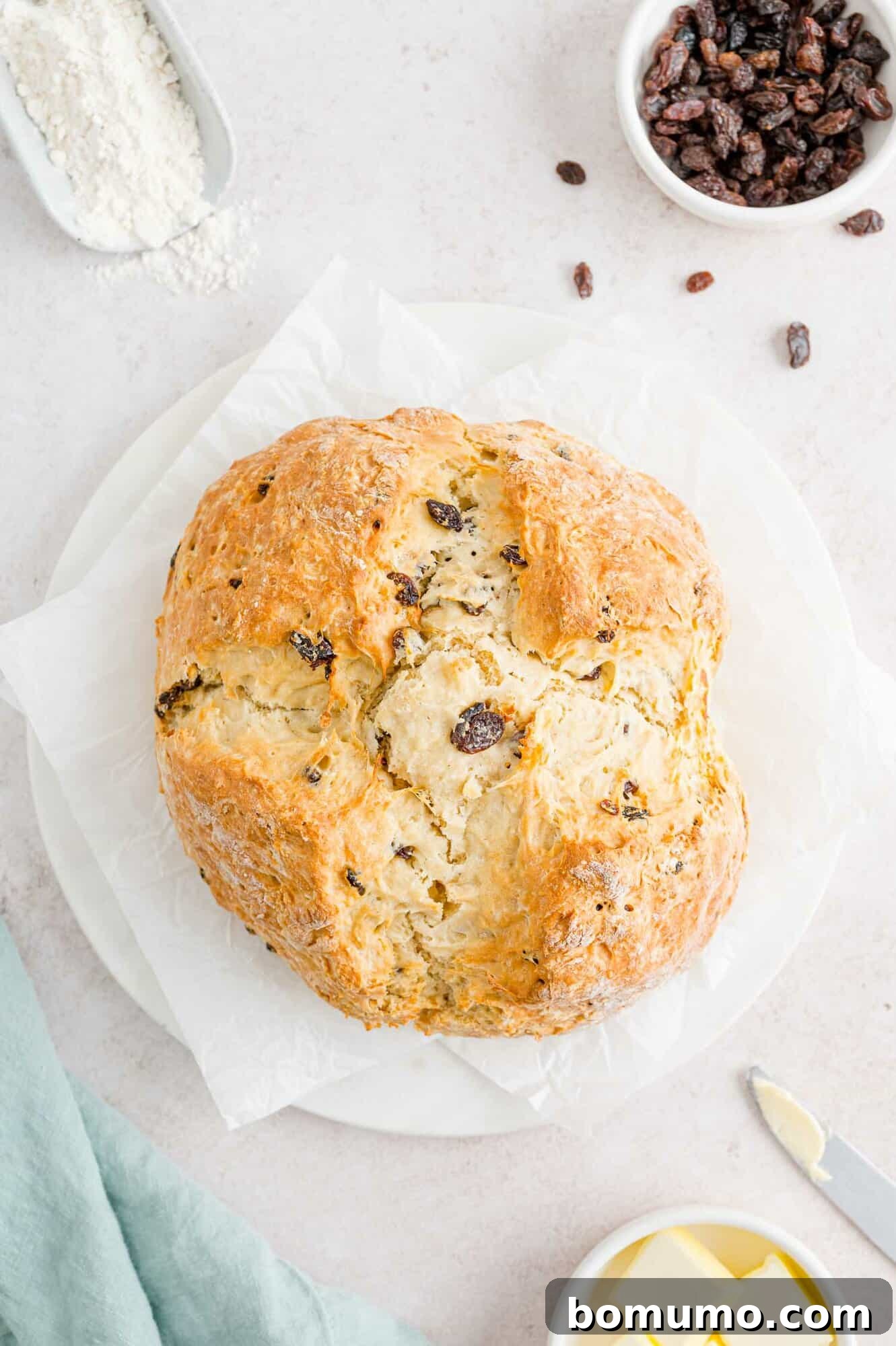 Freshly baked Irish soda bread, unsliced, cooling on a wire rack.