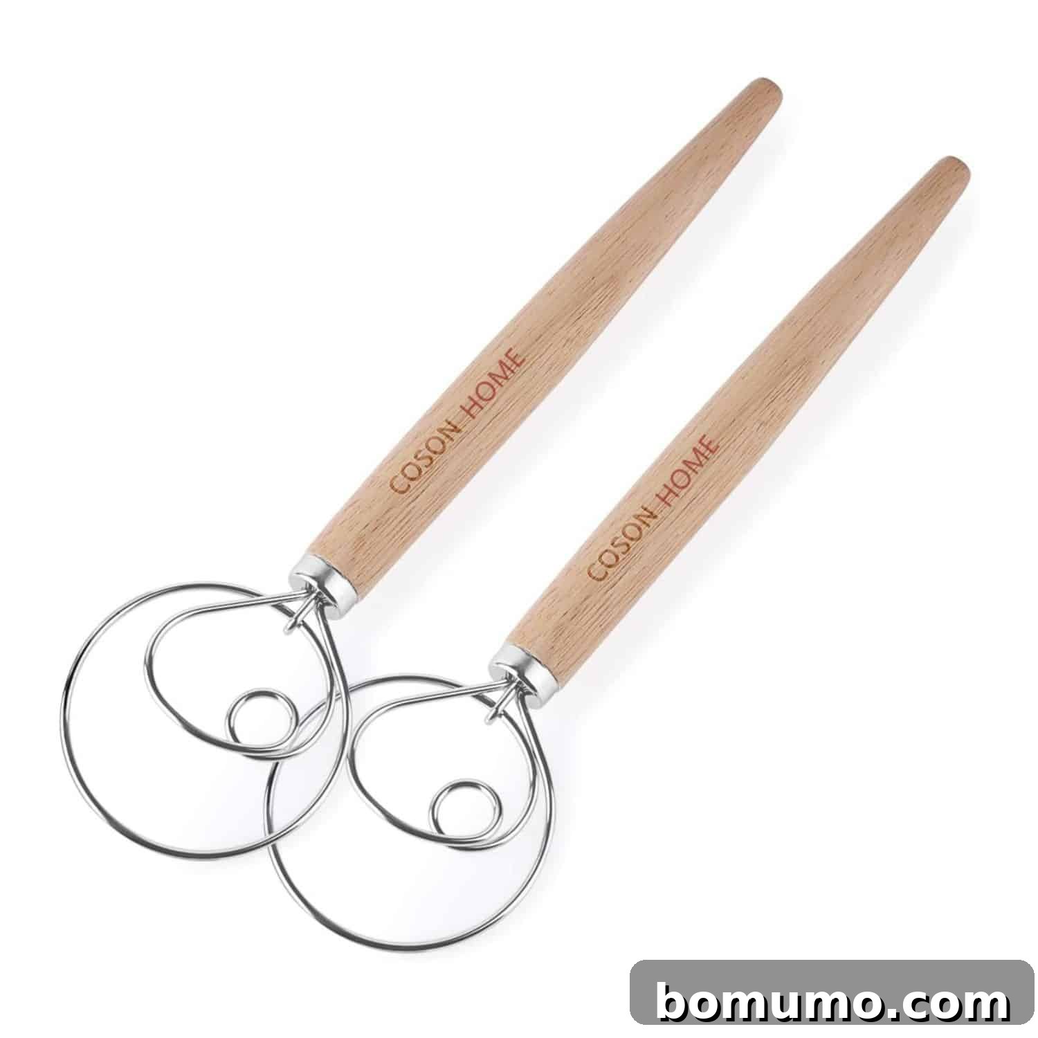Two dough whisks against a white background.